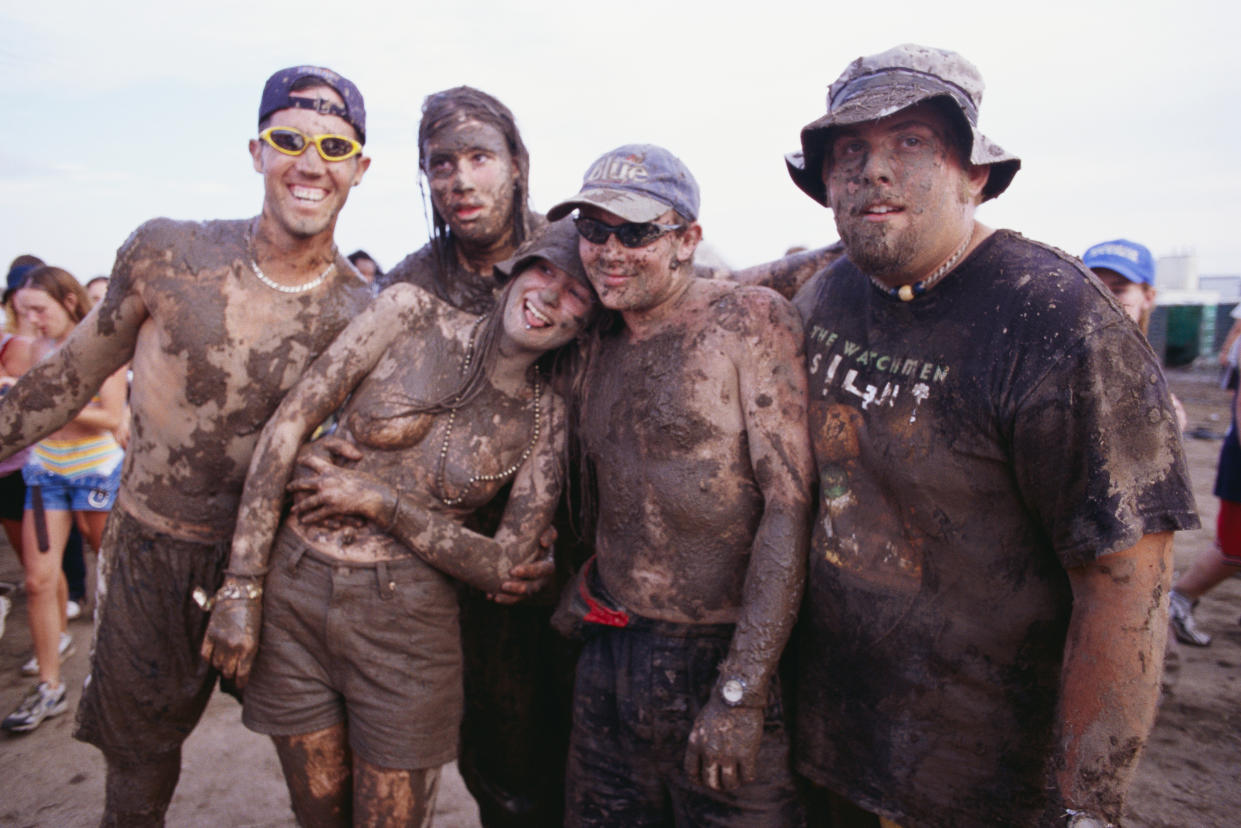 People covered in mud.