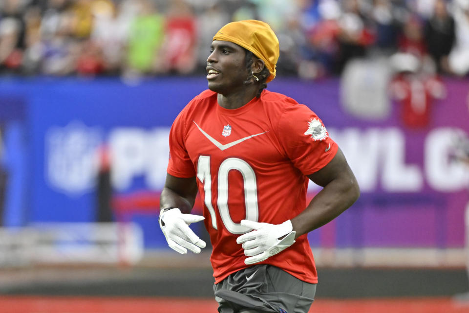 AFC wide receiver Tyreek Hill of the Miami Dolphins warms up before the flag football event at the NFL Pro Bowl, Sunday, Feb. 5, 2023, in Las Vegas. (AP Photo/David Becker)