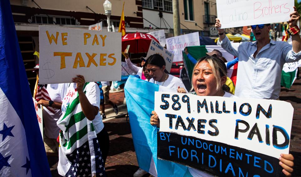 Anjali Sales, from Immokalee, takes part in a protest in Fort Myers on Wednesday, June 28, 2023. She was among more than 300 marchers protesting the SB-1718 bill that goes into effect on July 1. The march started at Centennial Park and ended almost 5 miles later at a restaurant on Palm Beach Boulevard.