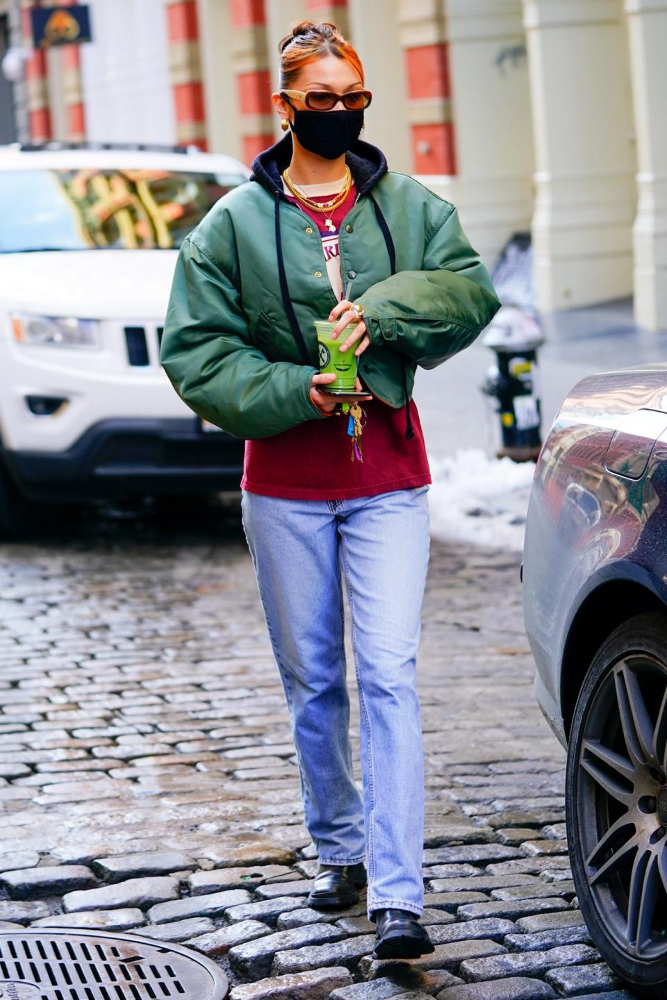 <p>Another day, another green juice for Bella Hadid, who matches her drink to her jacket in New York City on Tuesday.</p>