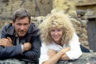 <p>Ford and Kate Capshaw on the set of <em>Indiana Jones and the Temple of Doom</em> in 1984.</p>