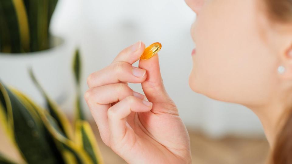 PHOTO: In an undated stock photo, a woman is seen taking a multivitamin.  (STOCK PHOTO/Getty Images)