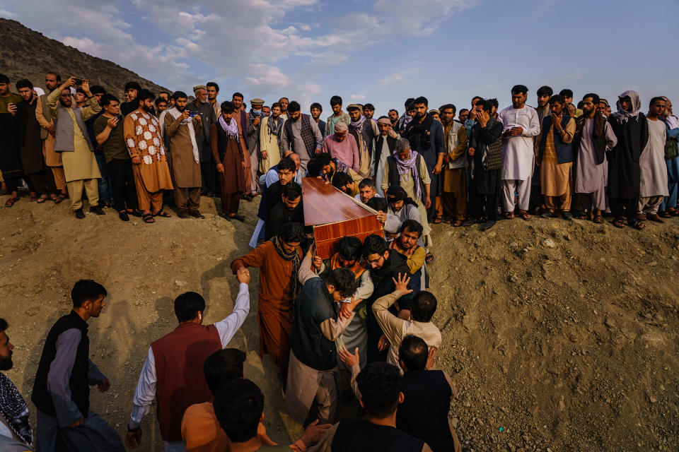 Relatives and friends attend a mass funeral on Aug. 30 for members of the family killed in the strike.<span class="copyright">Marcus Yam—Los Angeles Times/Getty Images</span>