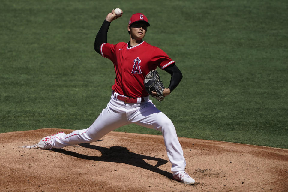 Los Angeles Angels starting pitcher Shohei Ohtani pitches during an intrasquad game at baseball practice at Angel Stadium on Tuesday, July 7, 2020, in Anaheim, Calif. (AP Photo/Ashley Landis)