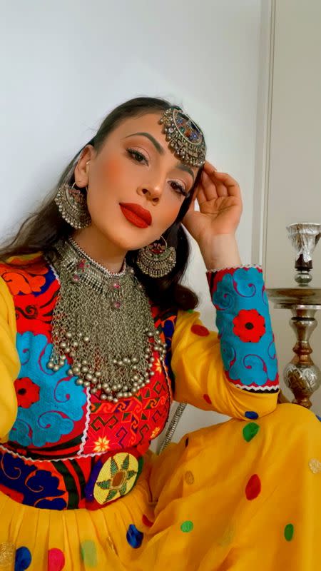 A woman poses in traditional Afghan attire, in Stavanger