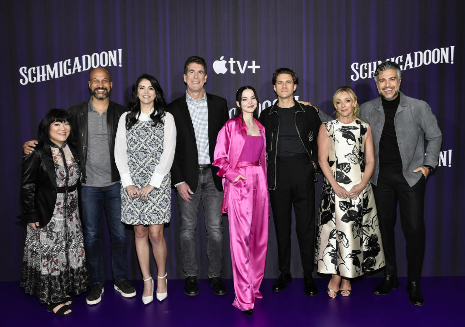 Ann Harada, left, Keegan-Michael Key, Cecily Strong, Cinco Paul, Dove Cameron, Aaron Tveit, Jane Krakowski and Jaime Camil participate in the "Schmigadoon!" season two cast photo call at the Park Lane Hotel on Tuesday, March 21, 2023, in New York. (Photo by Evan Agostini/Invision/AP)