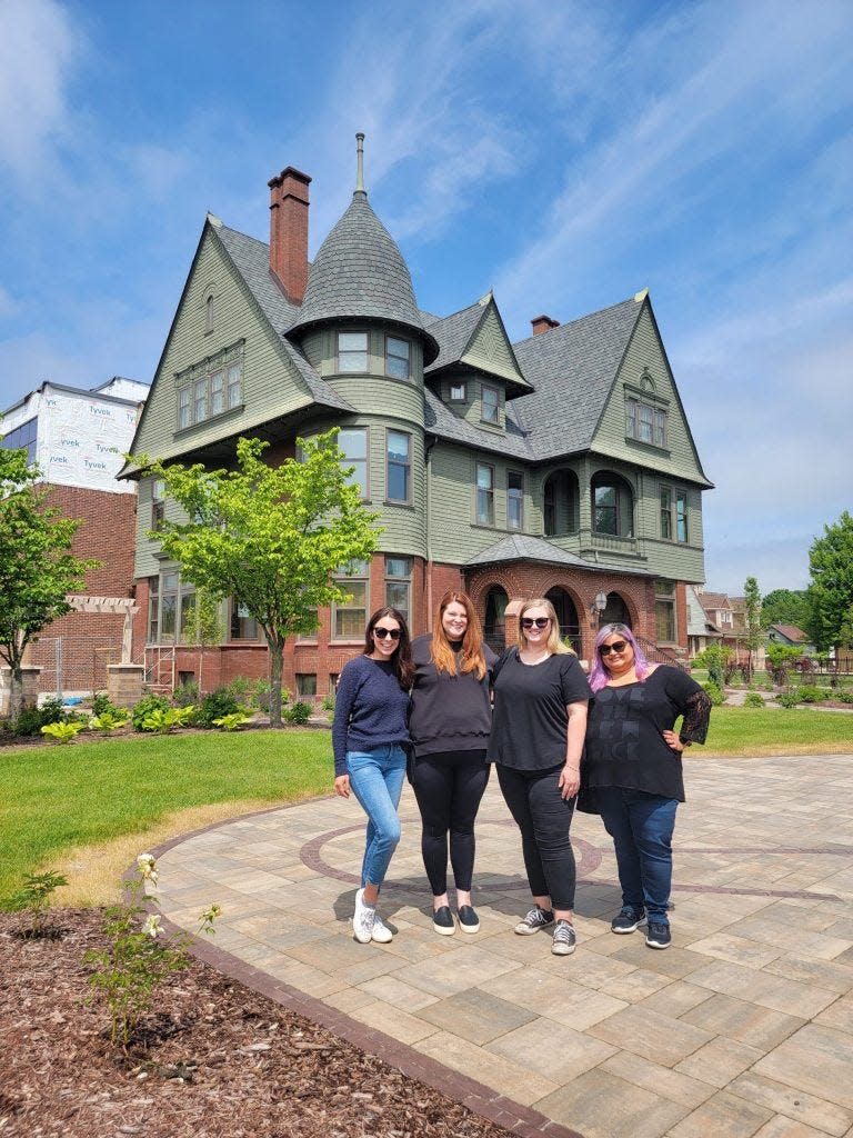 Courtney Hansen, far left, poses with three other women in front of the Rahr-West Art Museum in Manitowoc.