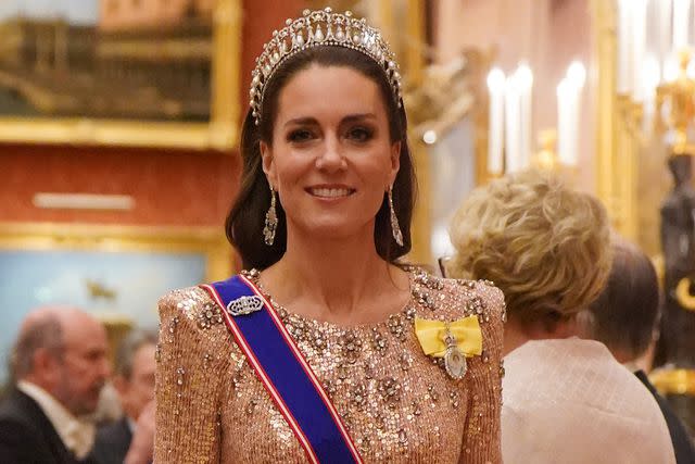 <p>Jonathan Brady - Pool / Getty</p> Kate Middleton at a reception for members of the Diplomatic Corps at Buckingham Palace on December 5, 2023.
