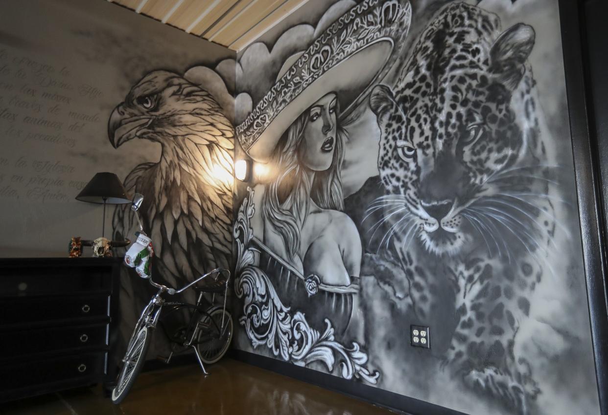 An air-brushed mural is seen on Wednesday, May 8, 2024, at Sugar Skull Tattoo in Bellevue, Wis.