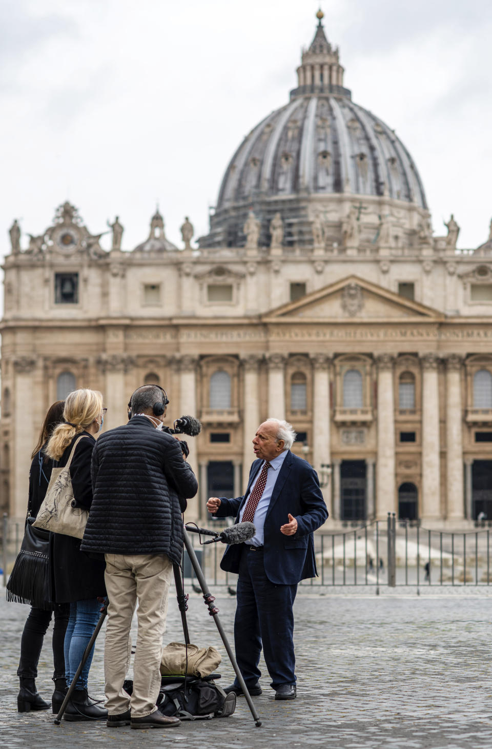 Former Associated Press Rome Bureau Chief Victor Simpson, right, speaks during an interview with The Associated Press at the Vatican, Thursday, April 29, 2021. Simpson, who covered the Vatican for over 30 years for The Associated Press before his retirement, recalls the graciousness of Pope Benedict XVI. (AP Photo/Domenico Stinellis)