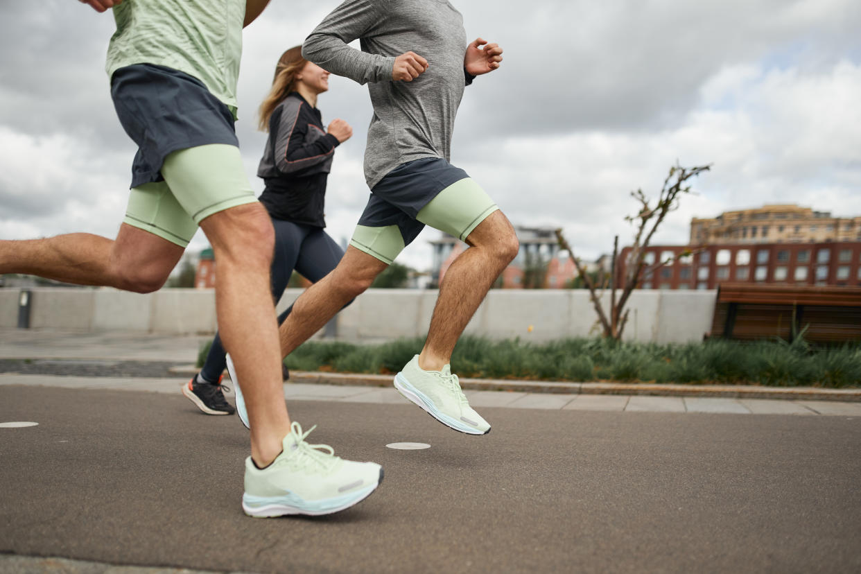 run, runners, group of people running on pavement, running essentials, what you need for long runs, marathon essentials, Five essential gear pieces that will help you conquer the trial of miles (Getty).