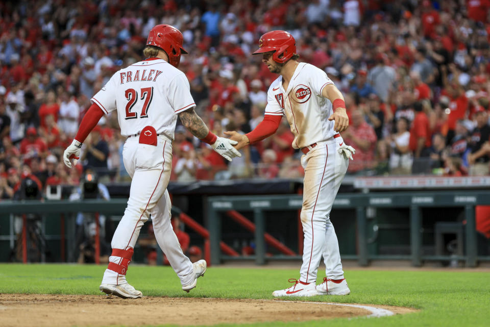 Cincinnati Reds' Jake Fraley, left, is congratulated by Kyle Farmer for his two-run home run against the Baltimore Orioles during the fifth inning of a baseball game in Cincinnati, Saturday, July 30, 2022. (AP Photo/Aaron Doster)