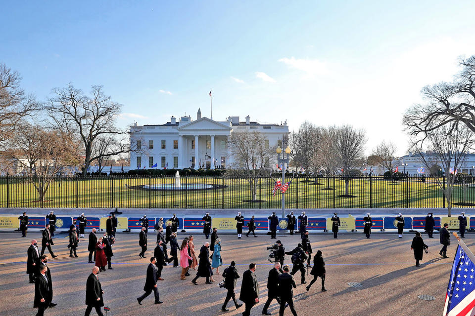 <p>Biden's family walks along the shortened parade route outside the White House in this zoomed-out shot. </p>