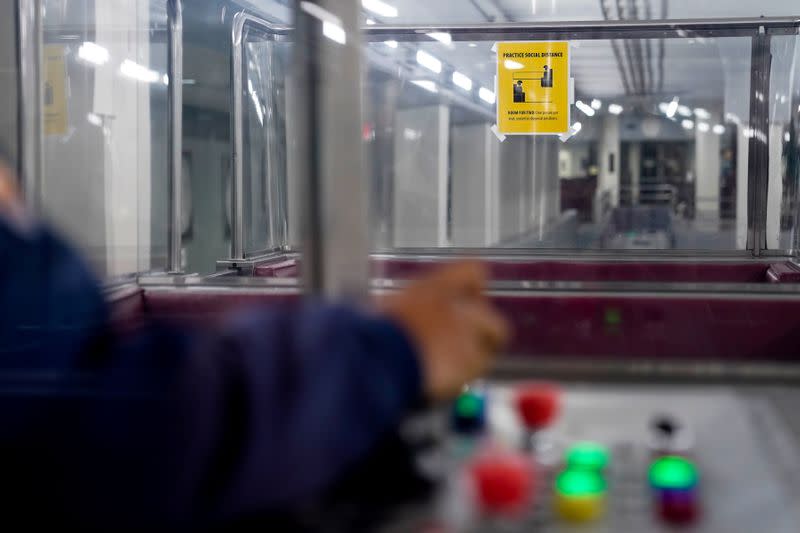 Social distancing signage is seen in a U.S. Capitol subway car in Washington