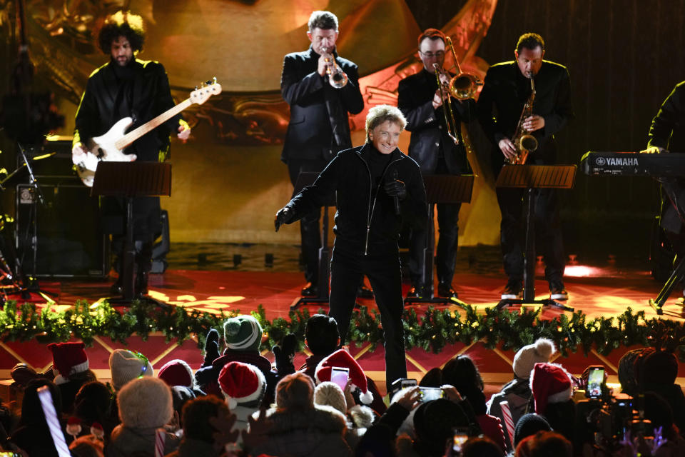 Barry Manilow performs during a television broadcast before the lighting of a Christmas tree at Rockefeller Center in New York, Wednesday, Nov. 29, 2023. (AP Photo/Seth Wenig)