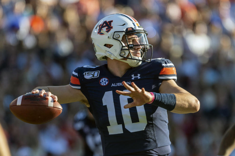 FKILE - In this Saturday, Nov. 30, 3019, file photo, Auburn quarterback Bo Nix (10) throws against Alabama during the first half of an NCAA college football game, in Auburn, Ala. Terry Wilson has waited for football's return even longer than most of his Southeastern Conference brethren. No. 23 Kentucky's quarterback will take the field again Saturday, Sept. 26, 2020, at No. 8 Auburn, returning from a knee injury that cost him almost all of last season. His Tigers' counterpart in the SEC's opening weekend is Bo Nix, coming off a strong freshman season.(AP Photo/Vasha Hunt, File)