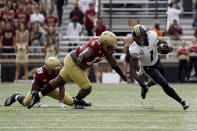 Missouri running back Tyler Badie (1) rushes with the ball past Boston College defensive lineman Khris Banks (13) during the first half of an NCAA college football game, Saturday, Sept. 25, 2021, in Boston. (AP Photo/Mary Schwalm)