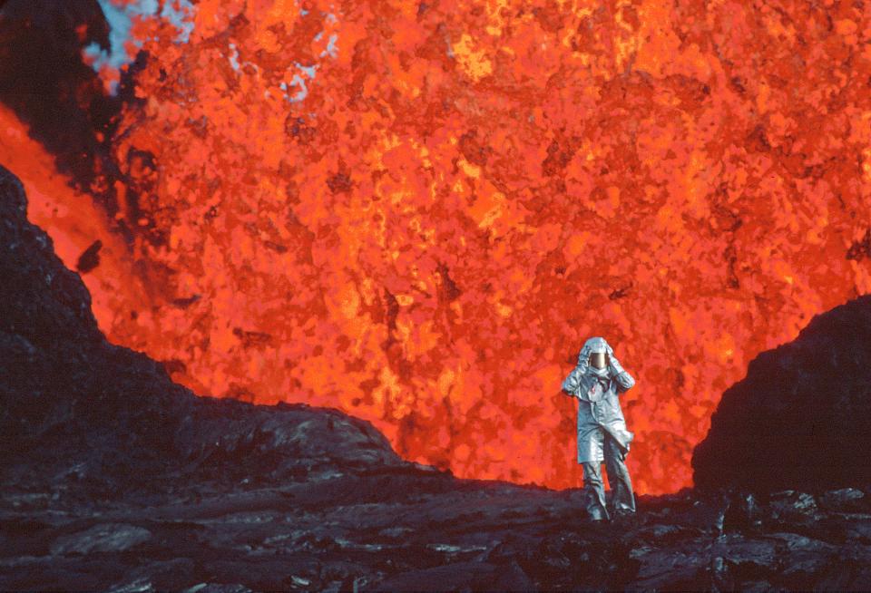 Katia Krafft wearing an aluminized suit stands near a lava burst at Krafla Volcano in Iceland in a scene from "Fire of Love," which will be one of multiple science-related movies shown at the Woods Hole Film Festival later this summer.