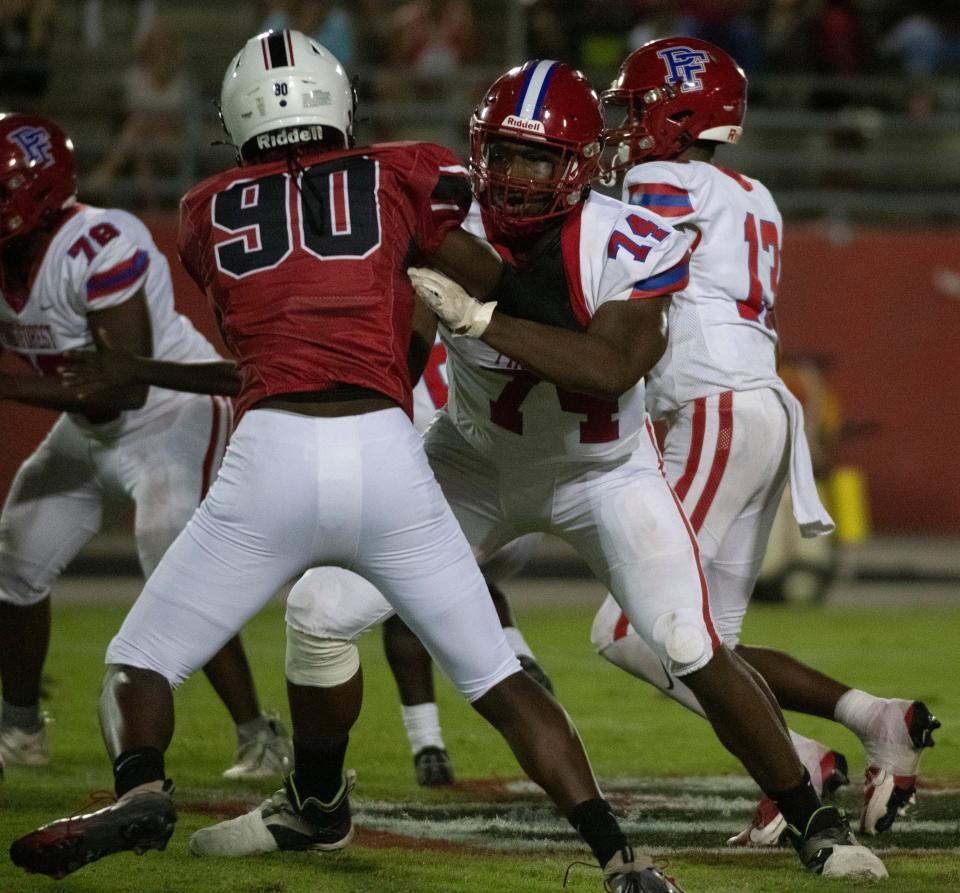 Pine Forest Jonathan Daniels (No. 74) blocks West Florida's Aaron-Jahmil Brown (No.90) at the line of scrimmage during Friday night's high school football matchup.