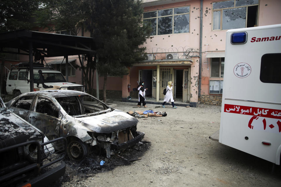 A body of a militant killed during an attack lies on the ground at a maternity hospital in Kabul, Afghanistan, Tuesday, May 12, 2020. Militants stormed a maternity hospital in the western part of Kabul on Tuesday, setting off an hours-long shootout with the police and killing over a dozen people, including two newborn babies, their mothers and an unspecified number of nurses (AP Photo/Rahmat Gul)