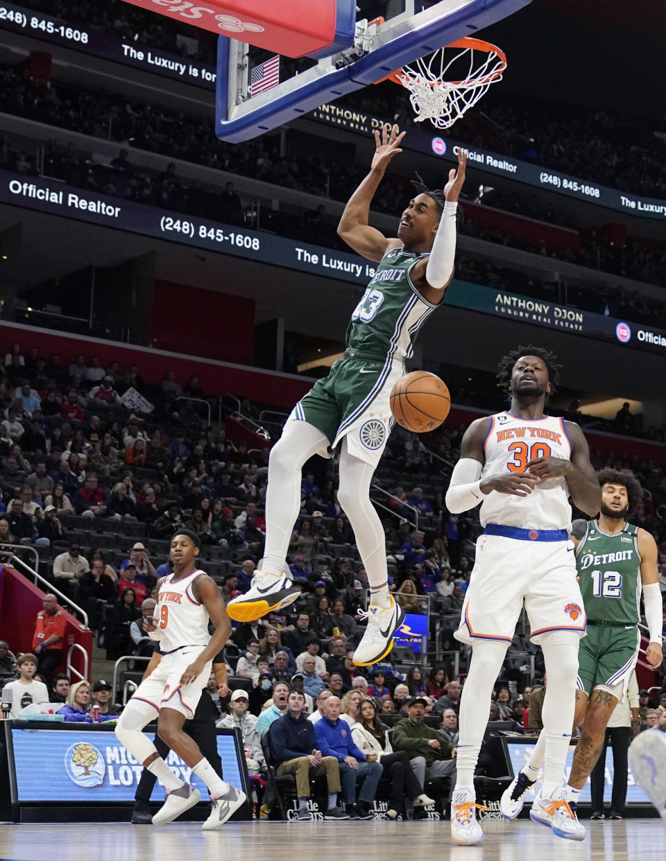 Detroit Pistons guard Jaden Ivey (23) dunks during the first half of an NBA basketball game against the New York Knicks, Sunday, Jan. 15, 2023, in Detroit. (AP Photo/Carlos Osorio)