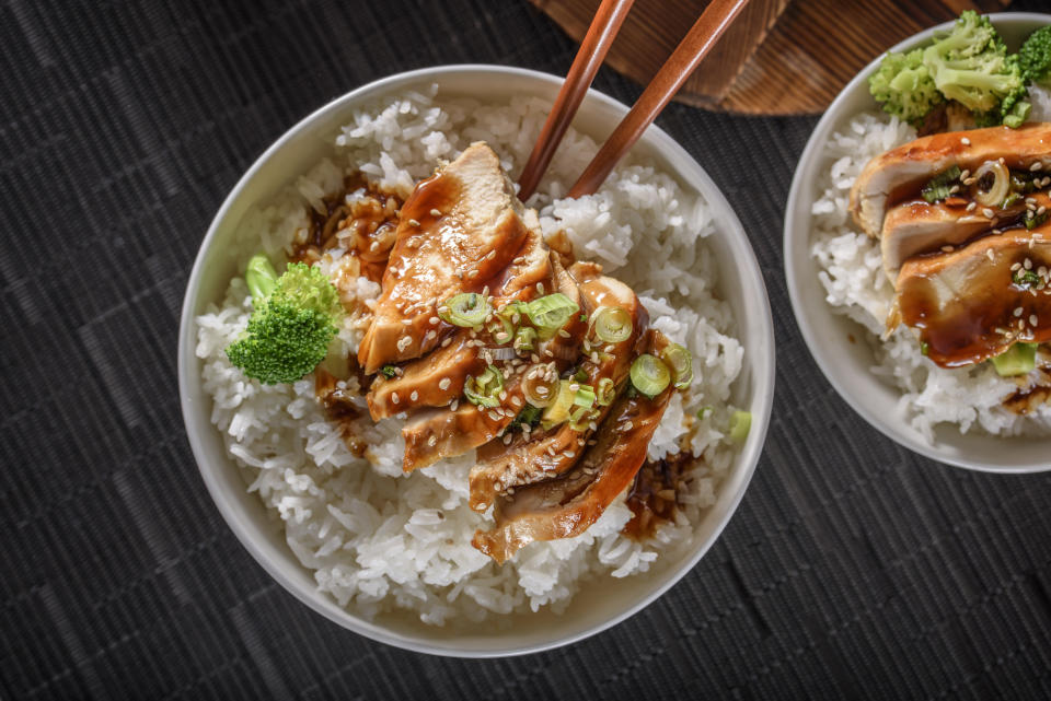 a rice bowl with chicken and broccoli