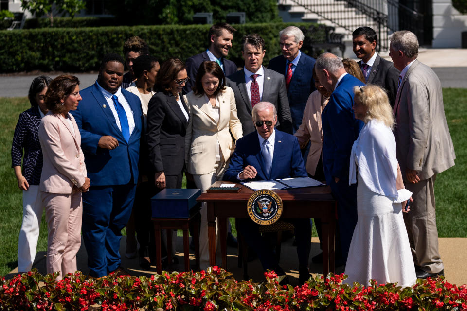 WASHINGTON, DC - AUGUST 09: President Joe Biden signs the CHIPS and Science Act of 2022 into law during an event at the South Lawn of the White House on Tuesday, Aug. 9, 2022 in Washington, DC. US semiconductor firms are announcing billions in investments as President Biden signs the broad competition bill that aims to support domestic semiconductor production, new high-tech jobs and scientific research. (Kent Nishimura / Los Angeles Times via Getty Images)