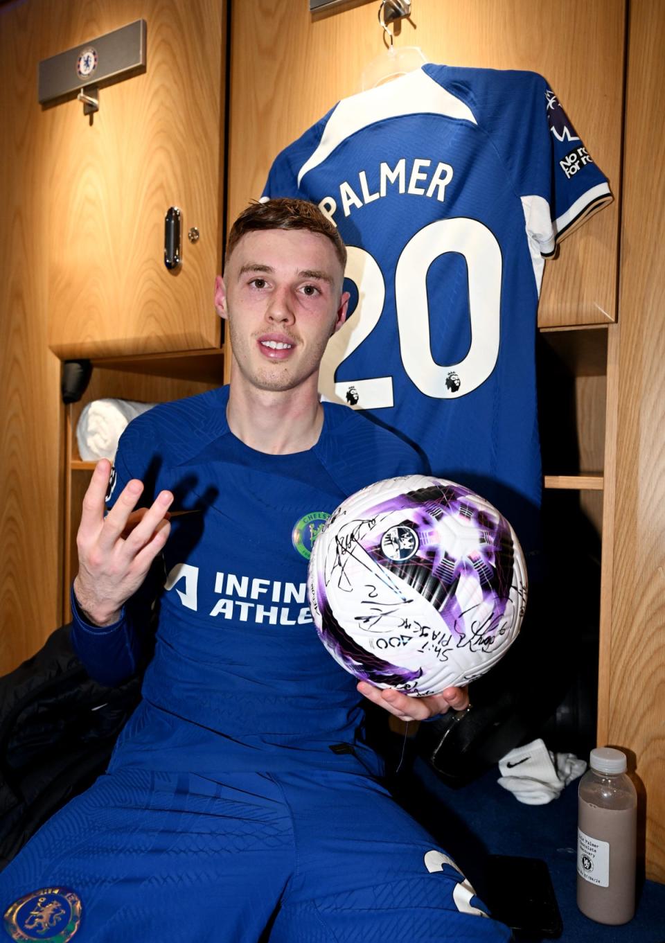 Cole Palmer celebrates his hat-trick in the Stamford Bridge home dressing room (Chelsea FC via Getty Images)