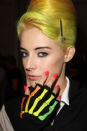 <b>PPQ </b><br><br>This unique beauty look featured yellow bouffant hair and coral coloured nails.<br><br>Image © Getty