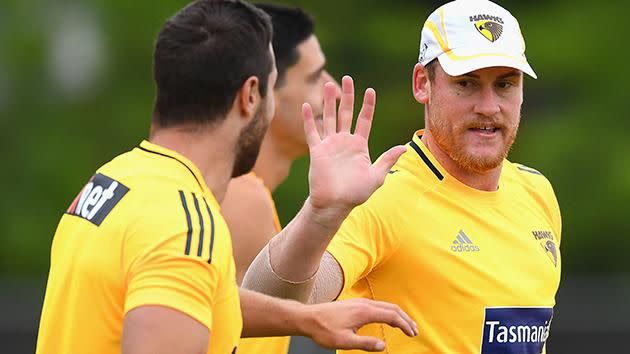 High fives all round as Roughead announces he is free of cancer. Pic: Getty