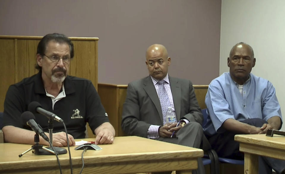 <p>Bruce Fromong testifies for former NFL football star O.J. Simpson, far right, as attorney, Malcolm LaVergne, center, listens during Simpson’s hearing at the Lovelock Correctional Center in Lovelock, Nev., on Thursday, July 20, 2017. Fromong, one of the sports memorabilia dealers in the robbery that put Simpson in prison, told the Nevada parole board that the former sports star apologized to him and he accepted it. (KOLO-TV via AP, POOL) </p>