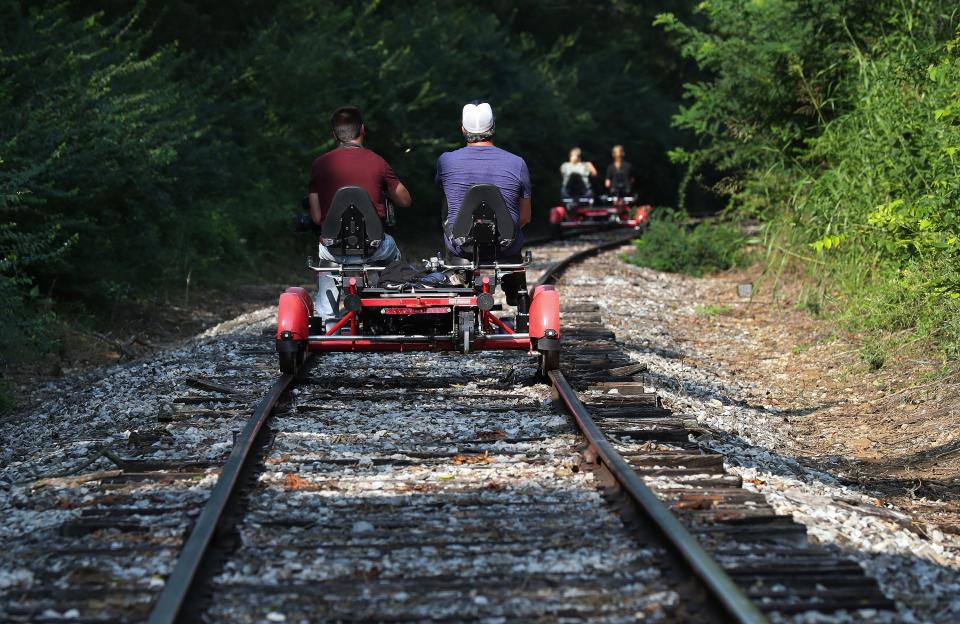 Riders were treated to a 10-mile round-trip scenic view of bourbon distilleries and horse farms aboard Rail Explorers railbikes in Versailles, Ky. on July 27, 2023.  