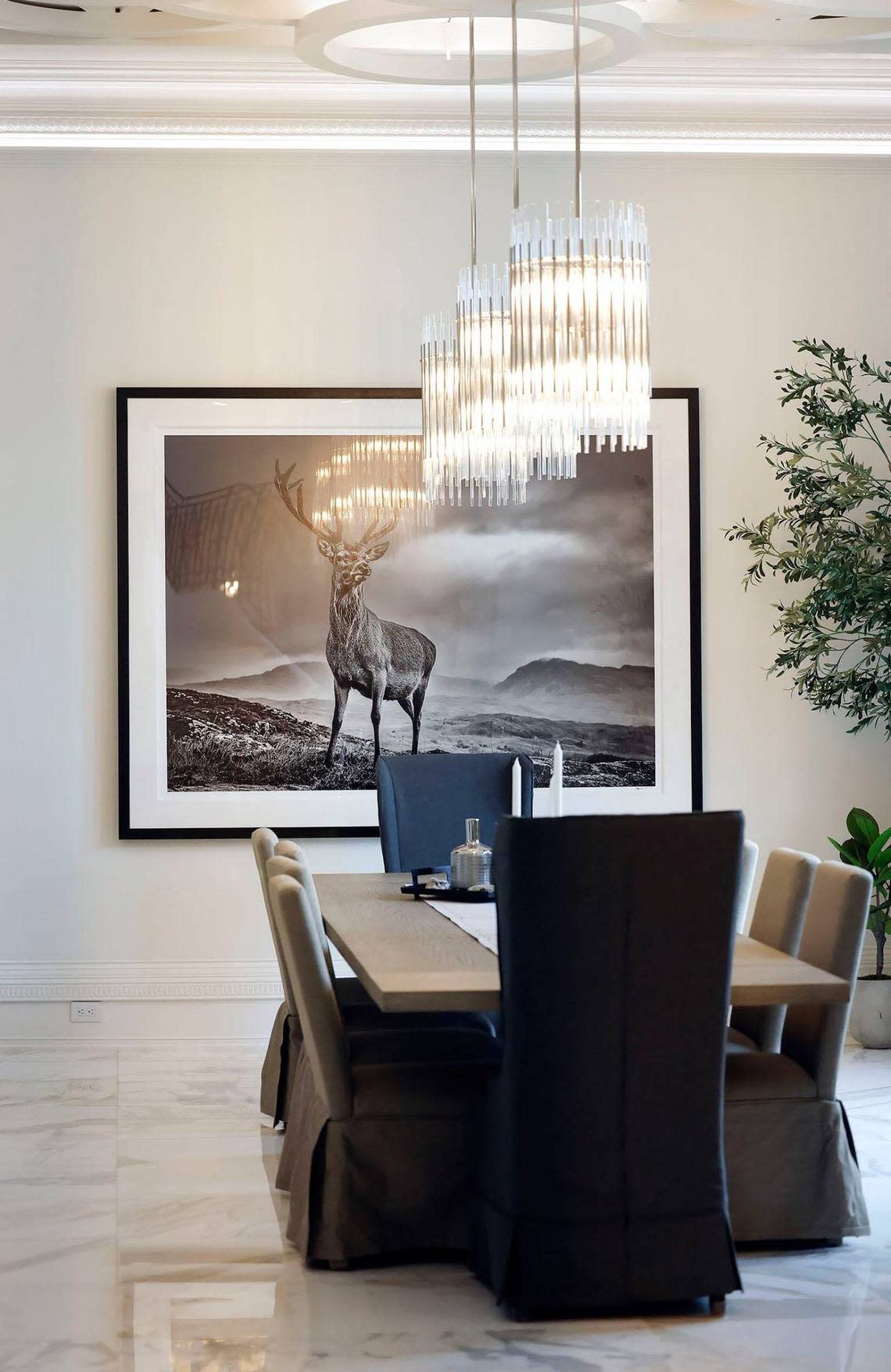 A dining area lies to the left of the main entrance of this $27 million Southlake home that features a symmetrical design in its layout.