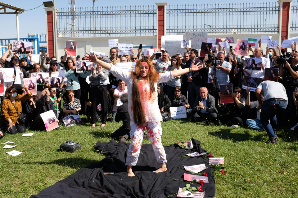 A protester shows her support for the Iranian women outside the UN headquarters in Erbil on Sept. 24, 2022. Iran has accused Kurdish opposition groups in exile of orchestrating the wave of protests across the country over the past two weeks. But Kurdish activists say the government is just trying to scapegoat them to distract from the domestic anger fueling the unrest. (AP Photo/Hawre Khalid, Metrography)