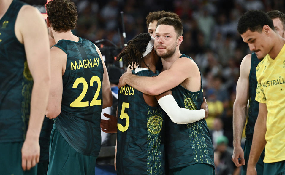 Boomers players, pictured here after their devastating loss at the Olympics.