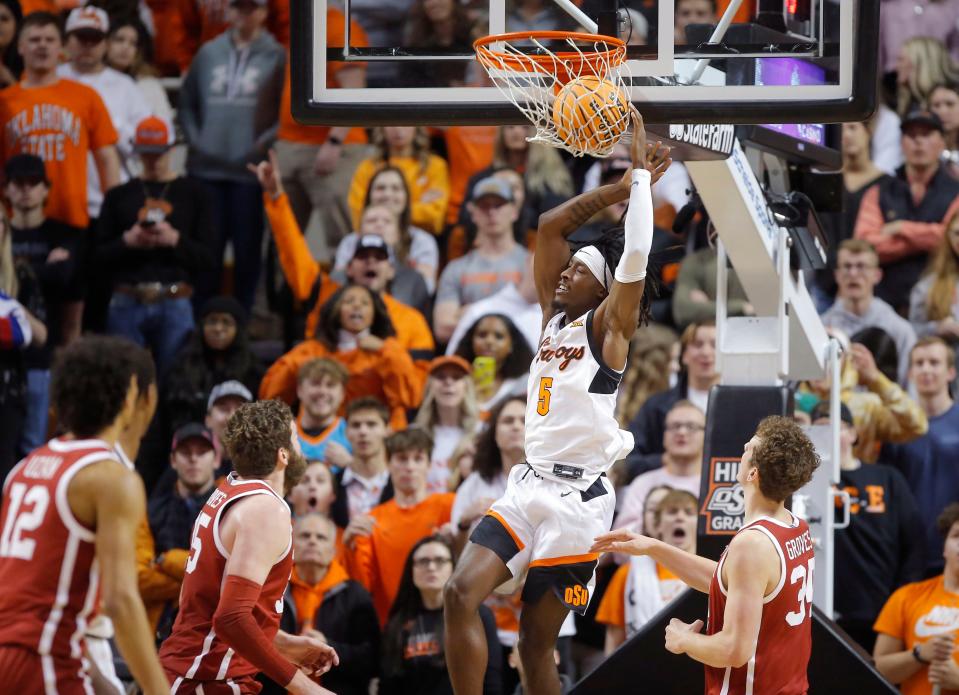 Oklahoma State's Caleb Asberry dunks the ball during the Cowboys' game against OU at Gallagher-Iba Arena in Stillwater on Wednesday, Jan. 18. Oklahoma State won 72-56.