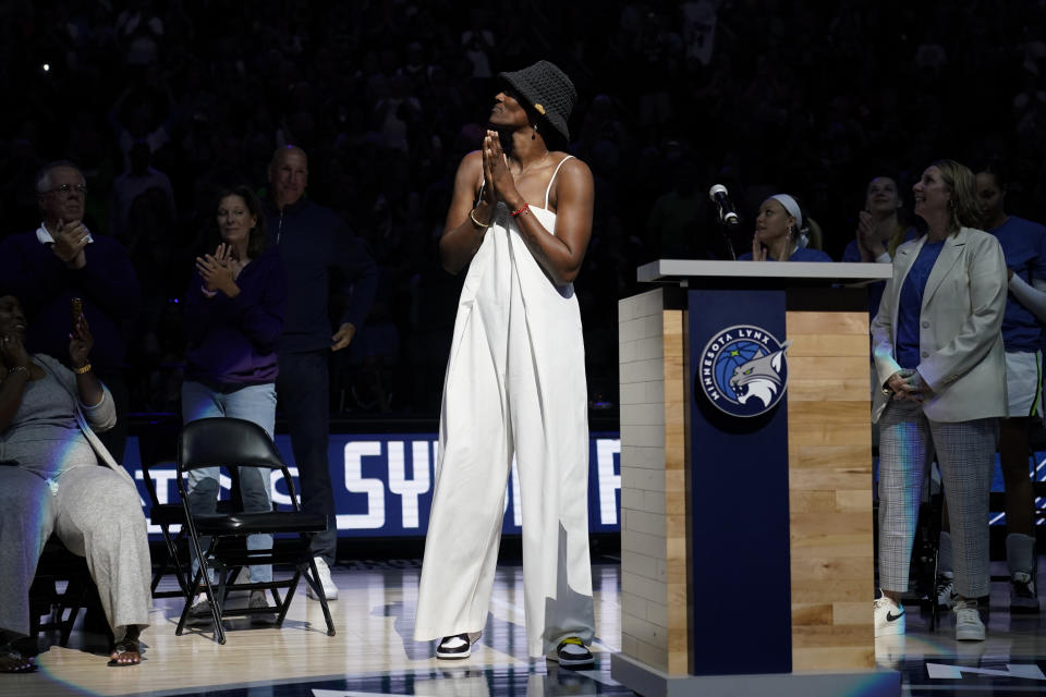 Former Minnesota Lynx player Sylvia Fowles watches as her jersey number is retired following a WNBA basketball game between the Minnesota Lynx and the Los Angeles Sparks, Sunday, June 11, 2023, in Minneapolis. (AP Photo/Abbie Parr)