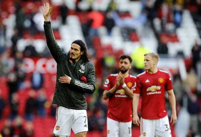 Edinson Cavani (left) applauds the fans