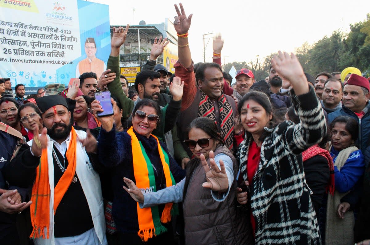 India's Bharatiya Janata Party supporters celebrate after Uttarakhand state lawmakers passed a uniform marriage law for all religions in Dehradun, India (AP)