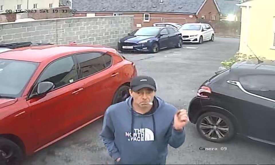 The man wore a blue North Face hoodie, navy baseball cap and was seen making two trips to the car with a holdall. (Wales News)