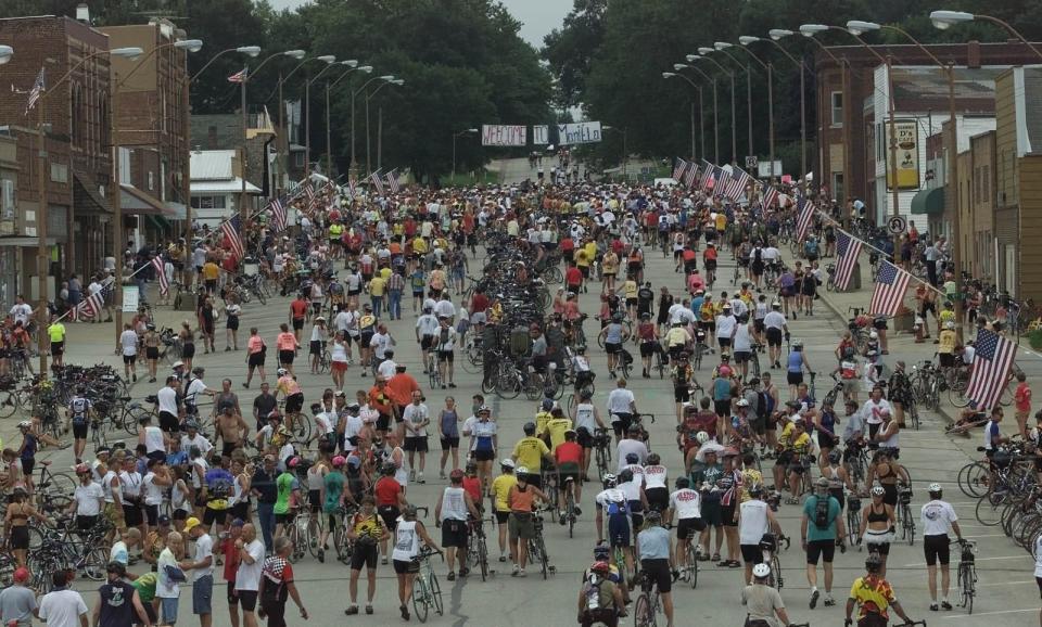 RAGBRAI riders file into the main street of Manilla on July 24, 2001.