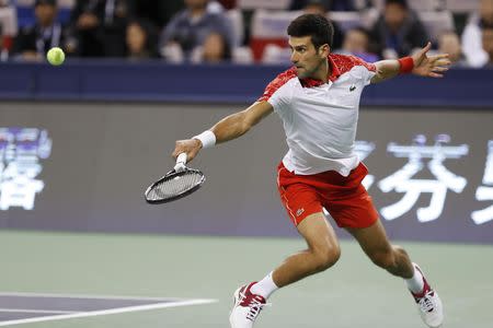 Tennis - Shanghai Masters - Men's Singles - Final - Qi Zhong Tennis Center, Shanghai, China - October 14, 2018. Novak Djokovic of Serbia in action against Borna Coric of Croatia. REUTERS/Aly Song