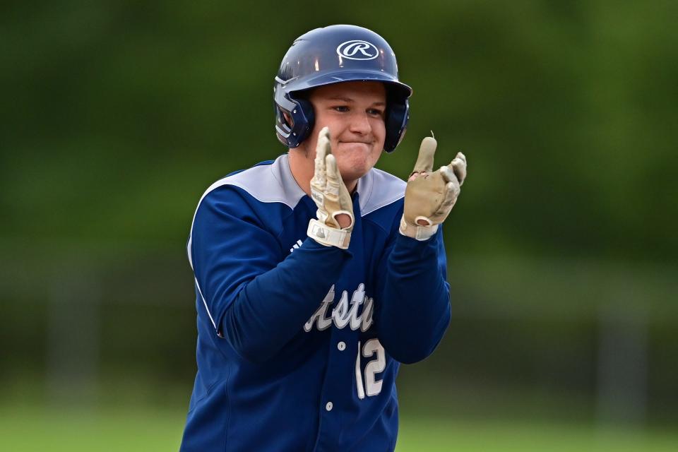 Rootstown's Blake Bower celebrates after hitting a two-run single in the fourth inning of their district semifinal against Cardinal Mooney at Cene Park in Struthers.