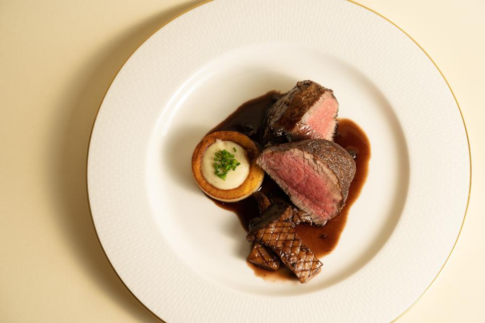 The filet mignon features an 8-ounce beef tenderloin with king trumpet mushrooms, "thousand layer" potato, and bordelaise sauce at Oak Park.