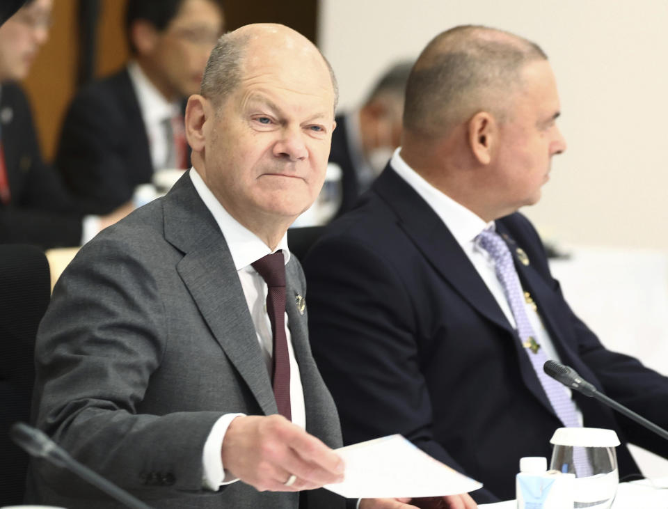 German Chancellor Olaf Scholz attends an outreach session of the leaders of the G7 nations and invited countries, during the G7 Summit in Hiroshima, western Japan, Saturday, May 20, 2023. (Japan Pool via AP)