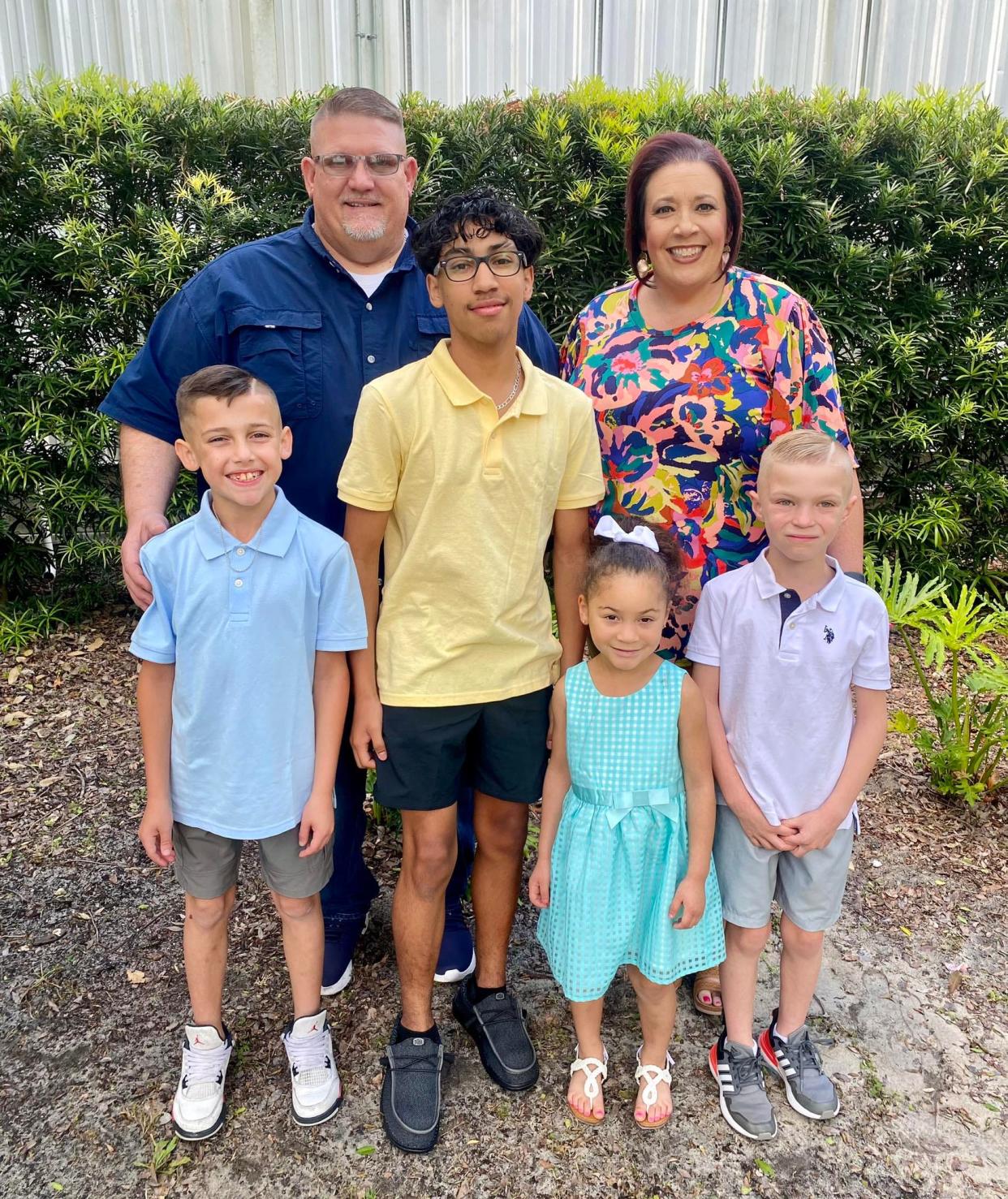 Bryan Abbott and Jamie Reisman Abbott with four kids who came into their home as foster children; some have been adopted: From left, Jacob, Jonathan, Leah and Jackson.