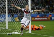 Germany's Andre Schuerrle celebrates his goal against Algeria during extra time in their 2014 World Cup round of 16 game at the Beira Rio stadium in Porto Alegre June 30, 2014. REUTERS/Edgard Garrido