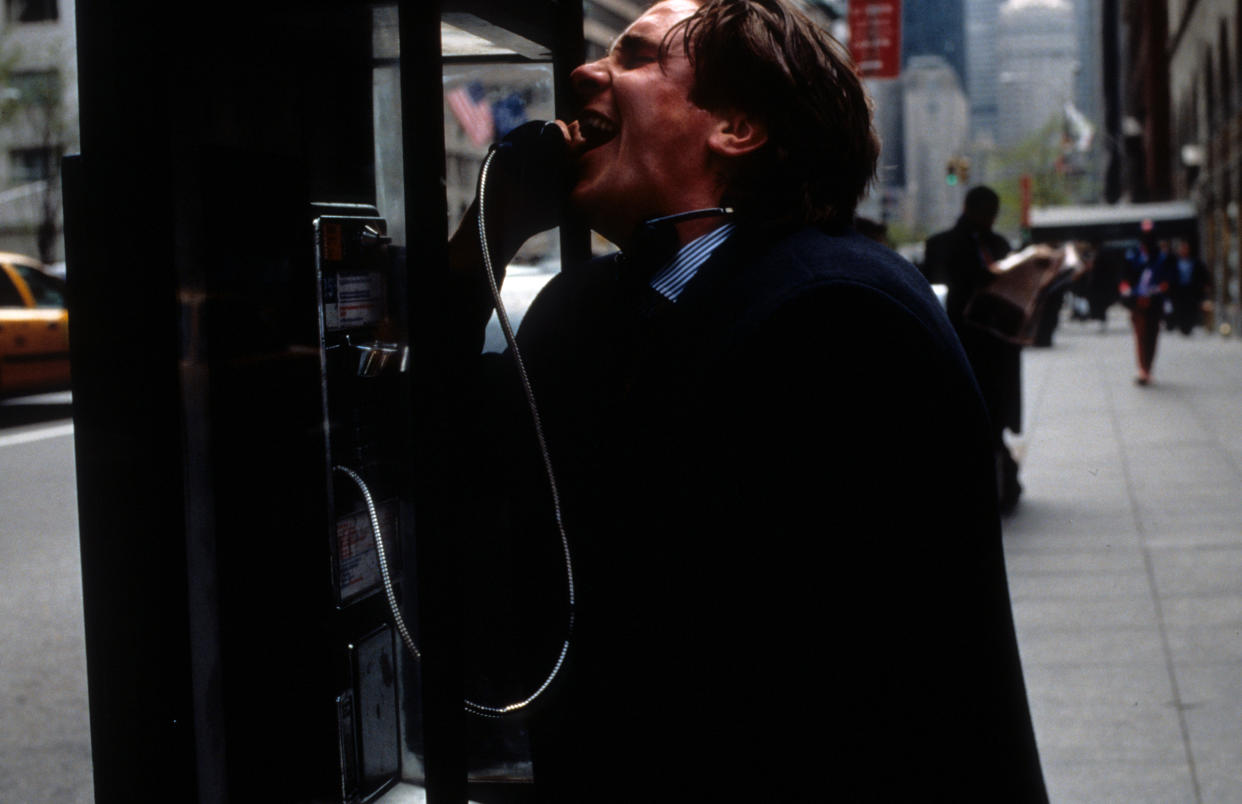 Christian Bale at pay phone in a scene from the film 'American Psycho', 2000. (Photo by Lion's Gate/Getty Images)