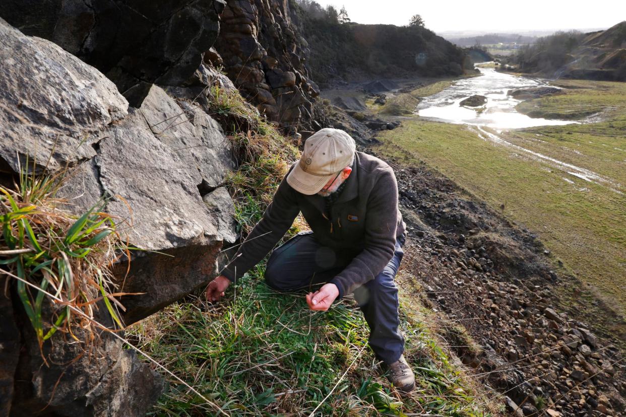 <span>George Smith inspects a peregrine falcon nest site in the Scottish borders.</span><span>Photograph: Murdo MacLeod/The Guardian</span>