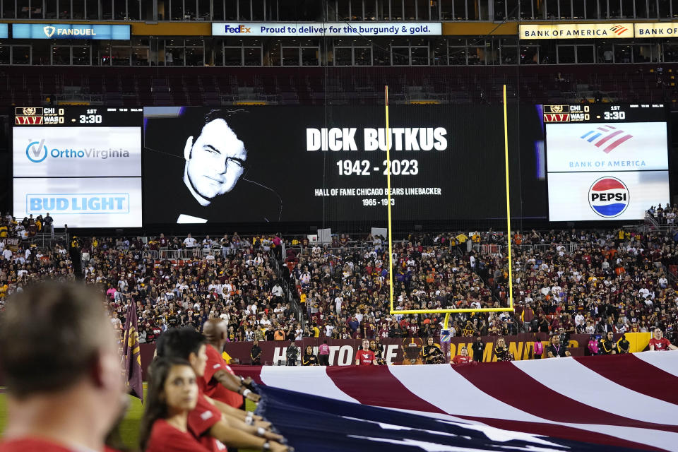 Scoreboard displays the image of Hall of Fame Chicago Bears player Dick Butkus during a moment of silence before the start of the first half of an NFL football game between the Washington Commanders and the Chicago Bears, Thursday, Oct. 5, 2023, in Landover, Md. Butkus, the fearsome middle linebacker for the Bears, has died, the team announced Thursday. (AP Photo/Alex Brandon)